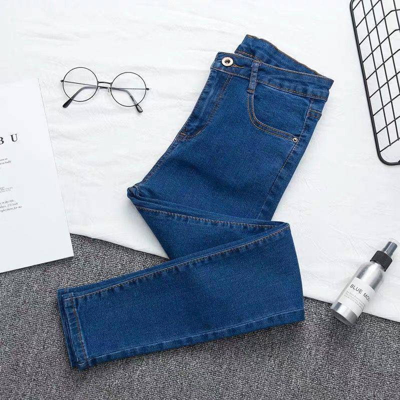 Close-up of the blue durable denim and cotton blend fabric of the trousers