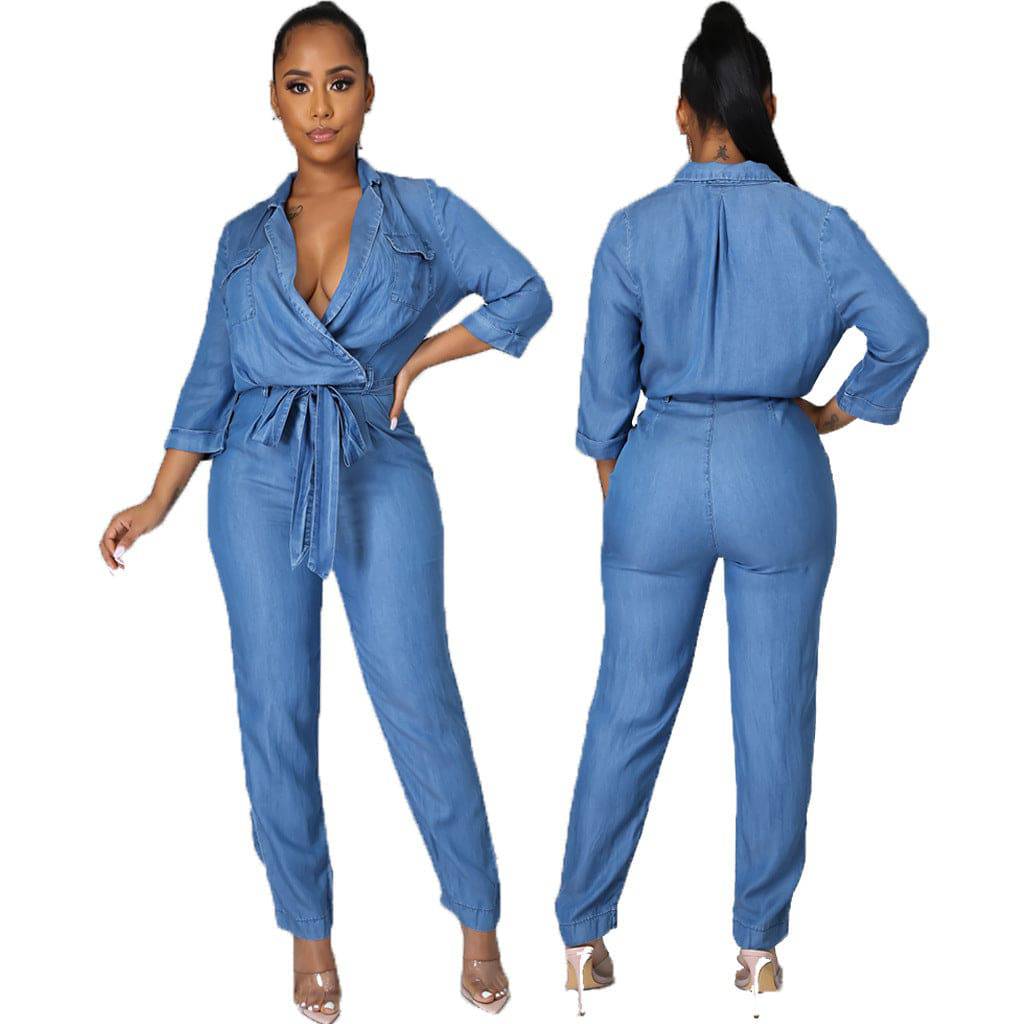 Back view of a women's denim jumpsuit showcasing the long sleeve and high-waist design