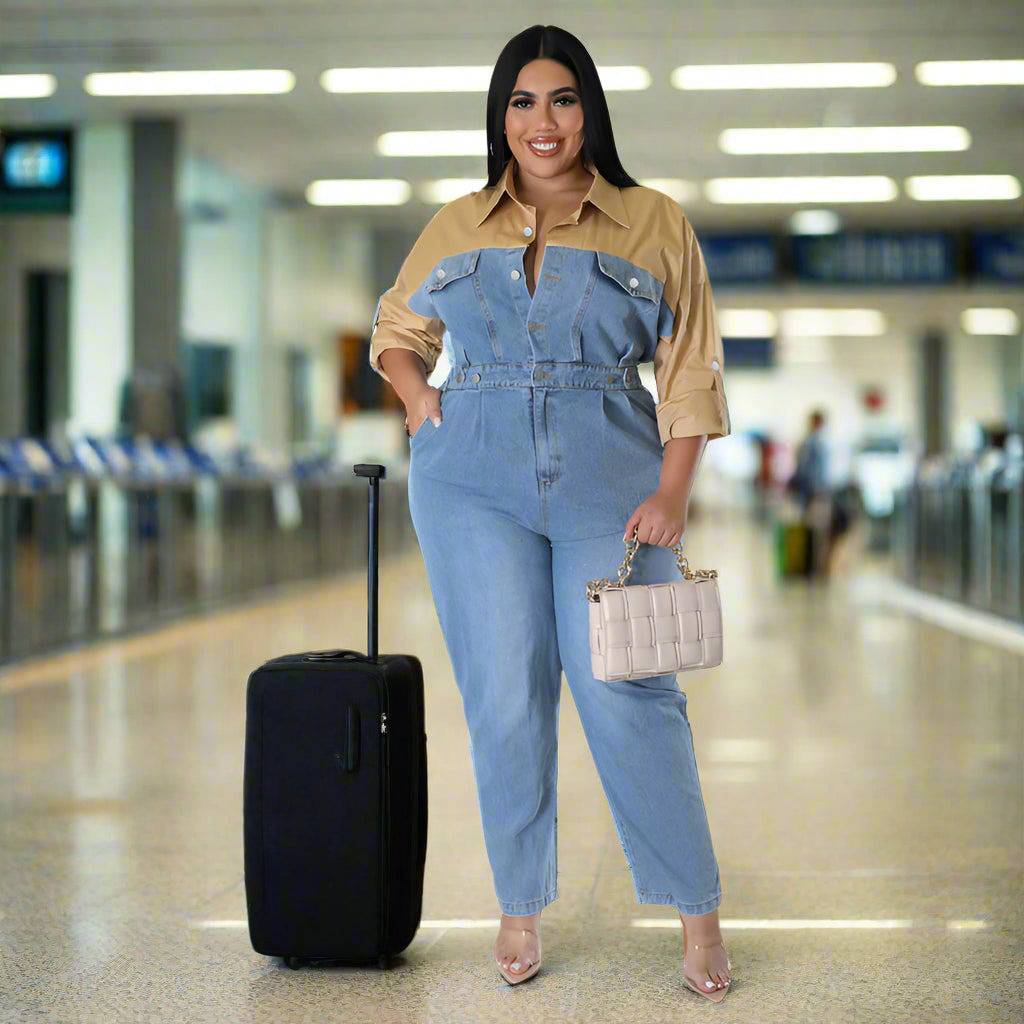 Model wearing a trendy long sleeve jumpsuit for plus-size women in an airport setting
